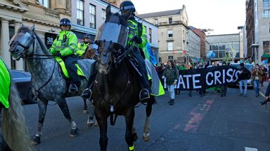 Mounted police officers escort Extinction Rebellion activists taking part in a demonstration against 'Greenwashing' (an attempt to make people believe that your company or government is doing more to protect the environment than it really is) near the COP26   PIC:AP